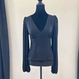 La Femme en Noir black vneck puff sleeve shirt